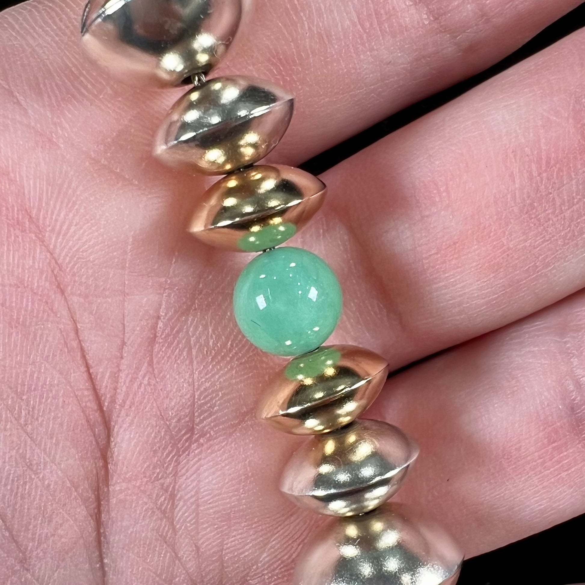 A silver, gold, and chrysoprase bead necklace handmade by Navajo artist, Alfred Joe.