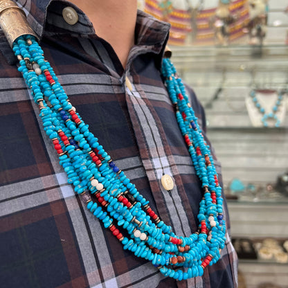 A Navajo Indian-made multistrand Sleeping Beauty turquoise bead necklace with coral, lapis lazuli, goldstone, and onyx accents.