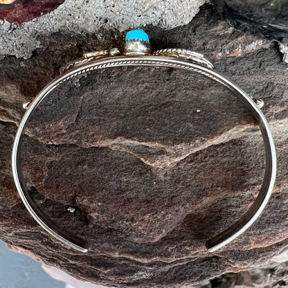 A ladies' sterling silver turquoise cuff bracelet.