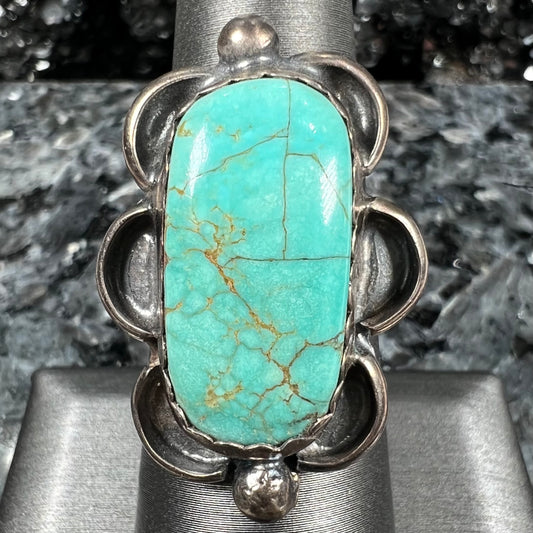 An estate sterling silver turquoise ring.  The ring was handmade by Navajo artist, Roy Buck.