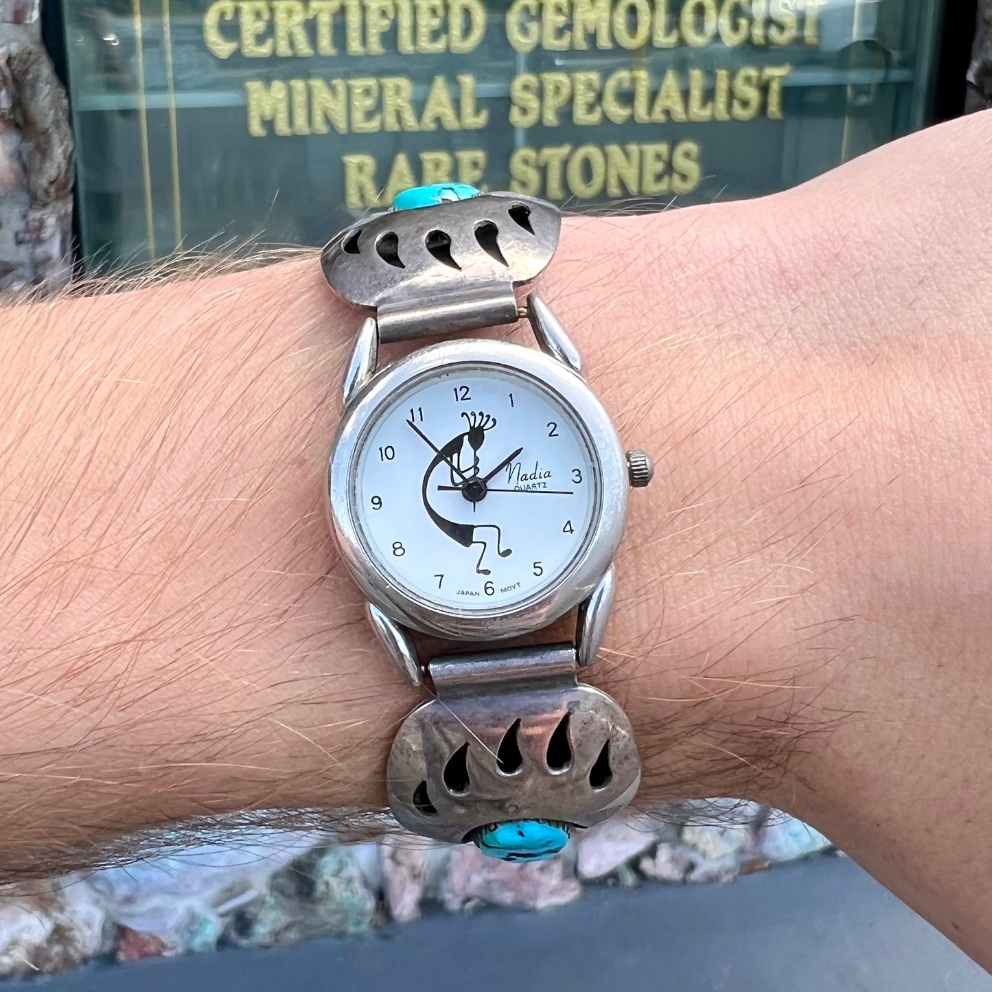 A watch set with two turquoise stones handmade by Navajo artists Arnold and Carleena Goodluck.