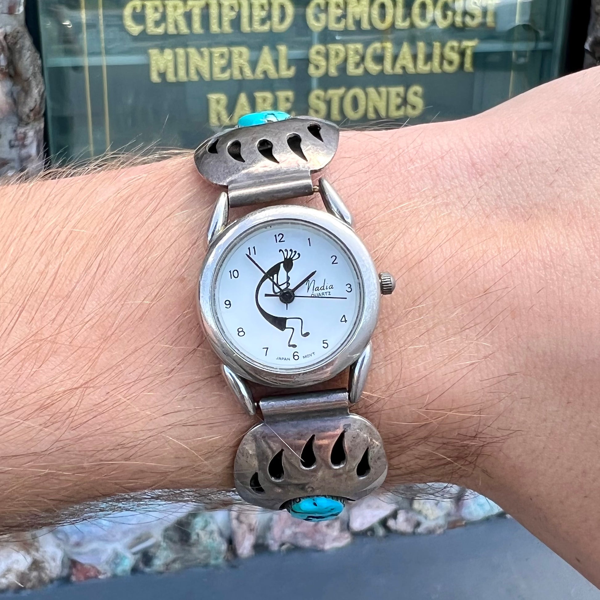 A watch set with two turquoise stones handmade by Navajo artists Arnold and Carleena Goodluck.