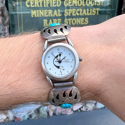 A watch set with two turquoise stones handmade by Navajo artists Arnold and Carleena Goodluck.