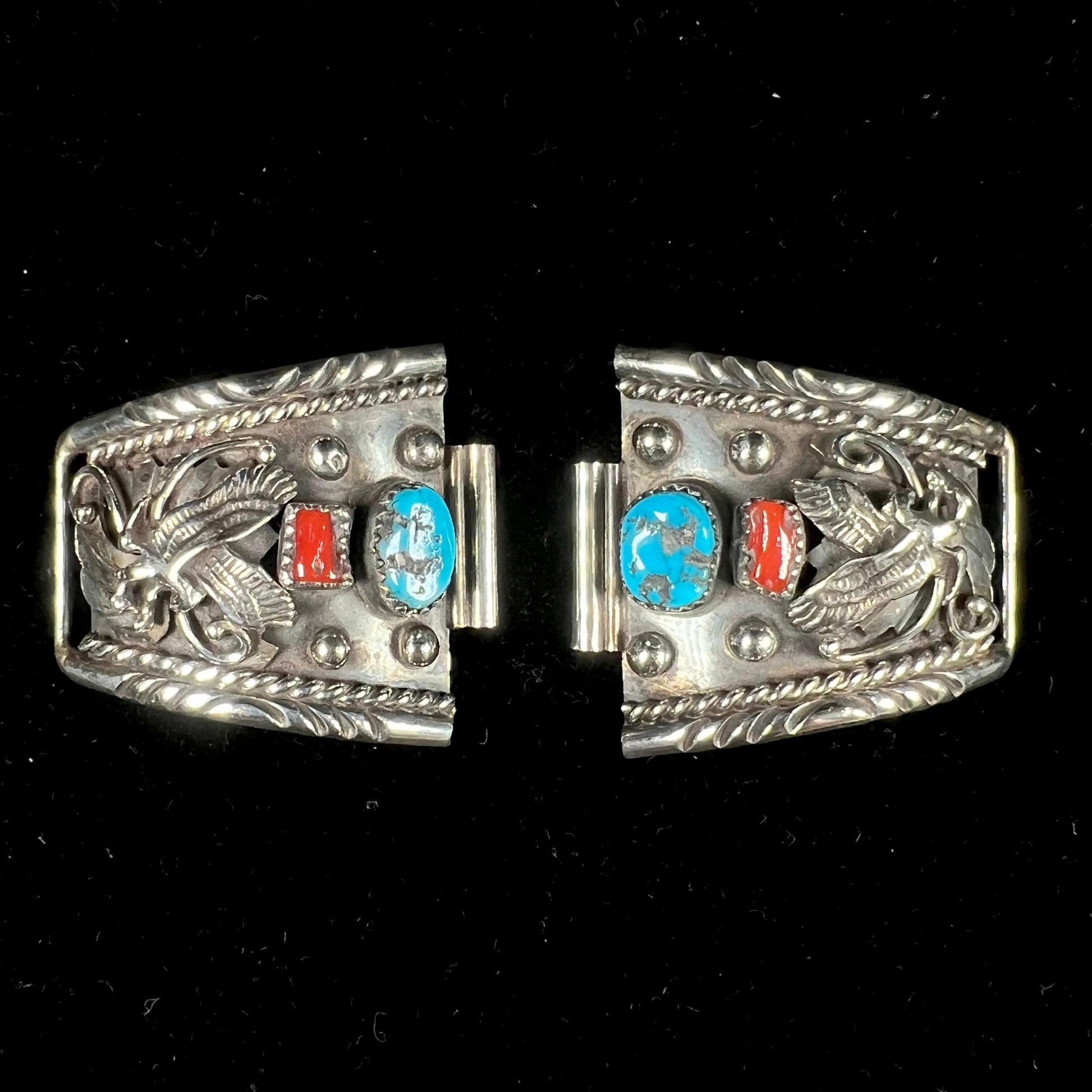 A pair of sterling silver watch cuff parts set with turquoise and coral stones handmade by Navajo artist, Genieve Werito.