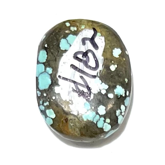 A light blue spiderweb turquoise stone with a greenish brown matrix from Number 8 Mine in Lander County, Nevada.