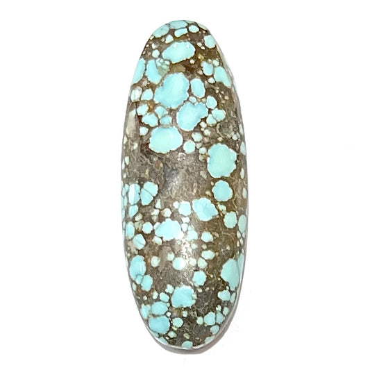 A loose, oval cabochon cut turquoise stone from the Number 8 Mine in Lander County, Nevada.