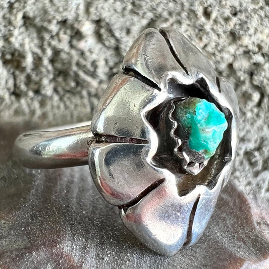 A handmade, sterling silver Native American turquoise nugget ring.