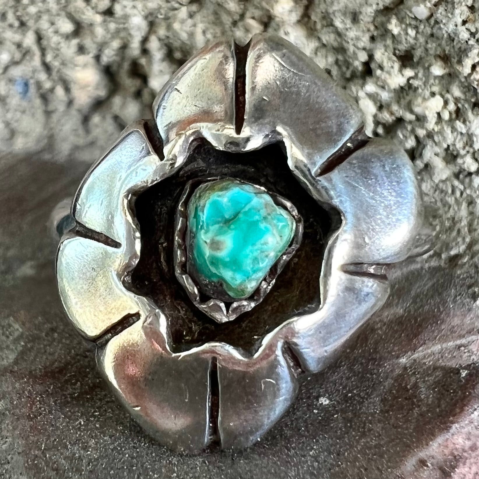 A handmade, sterling silver Native American turquoise nugget ring.
