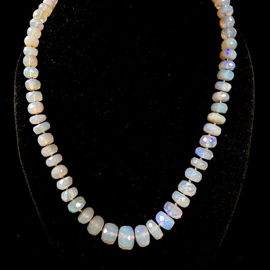A necklace strand of faceted white crystal opal beads with a white gold clasp.