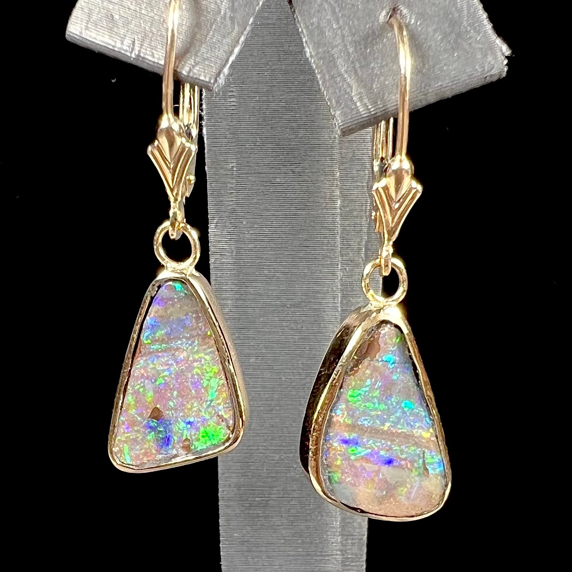 A pair of Australian boulder opal dangle earrings.