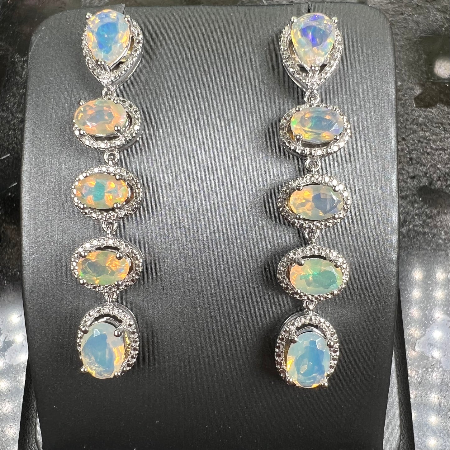 A pair of sterling silver Ethiopian opal dangle earrings.