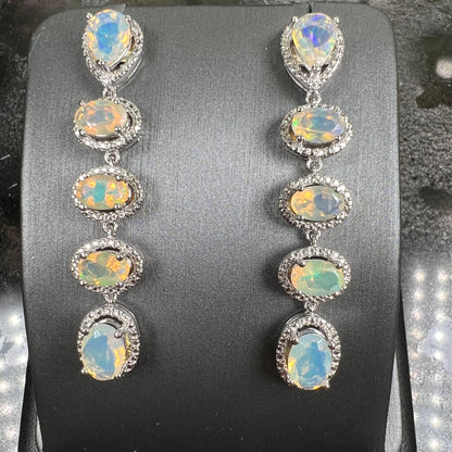 A pair of sterling silver Ethiopian opal dangle earrings.