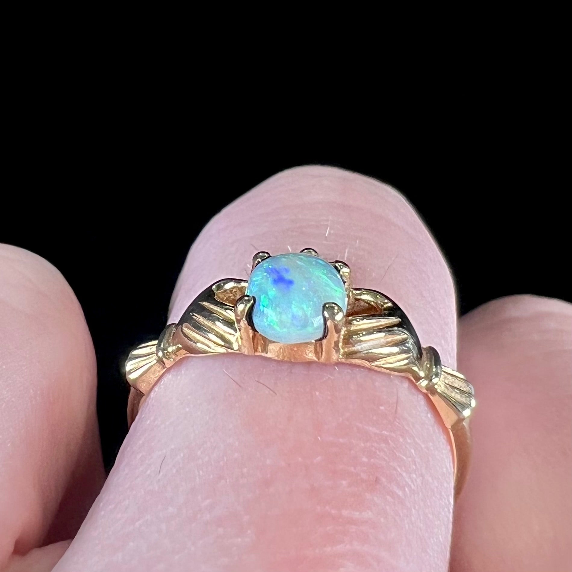 A vintage ladies' yellow gold opal and diamond claddagh ring.