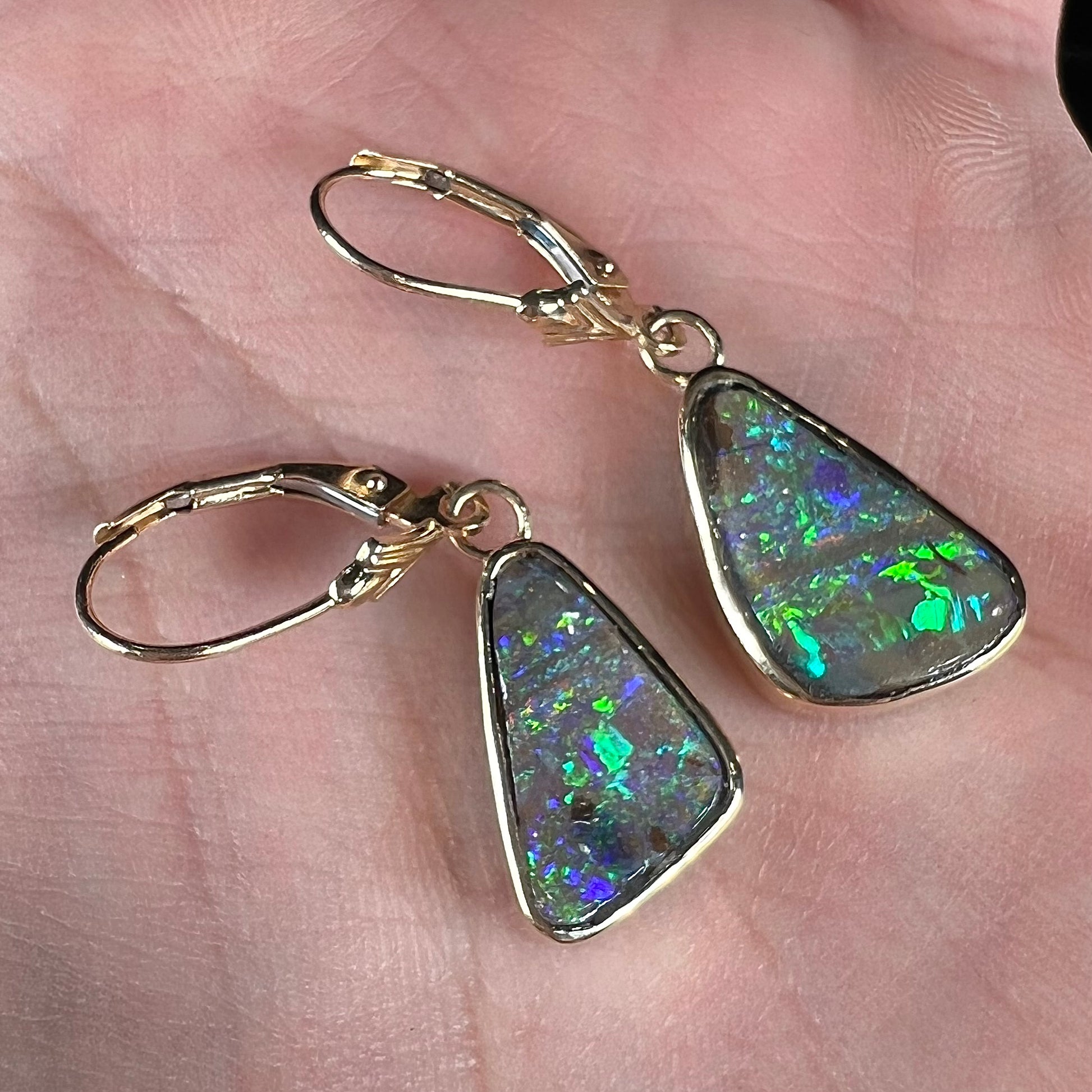 A pair of Australian boulder opal dangle earrings.