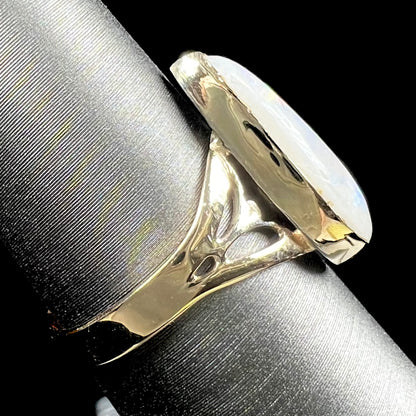 A ladies' pear shaped white crystal opal solitaire ring handmade in yellow gold.