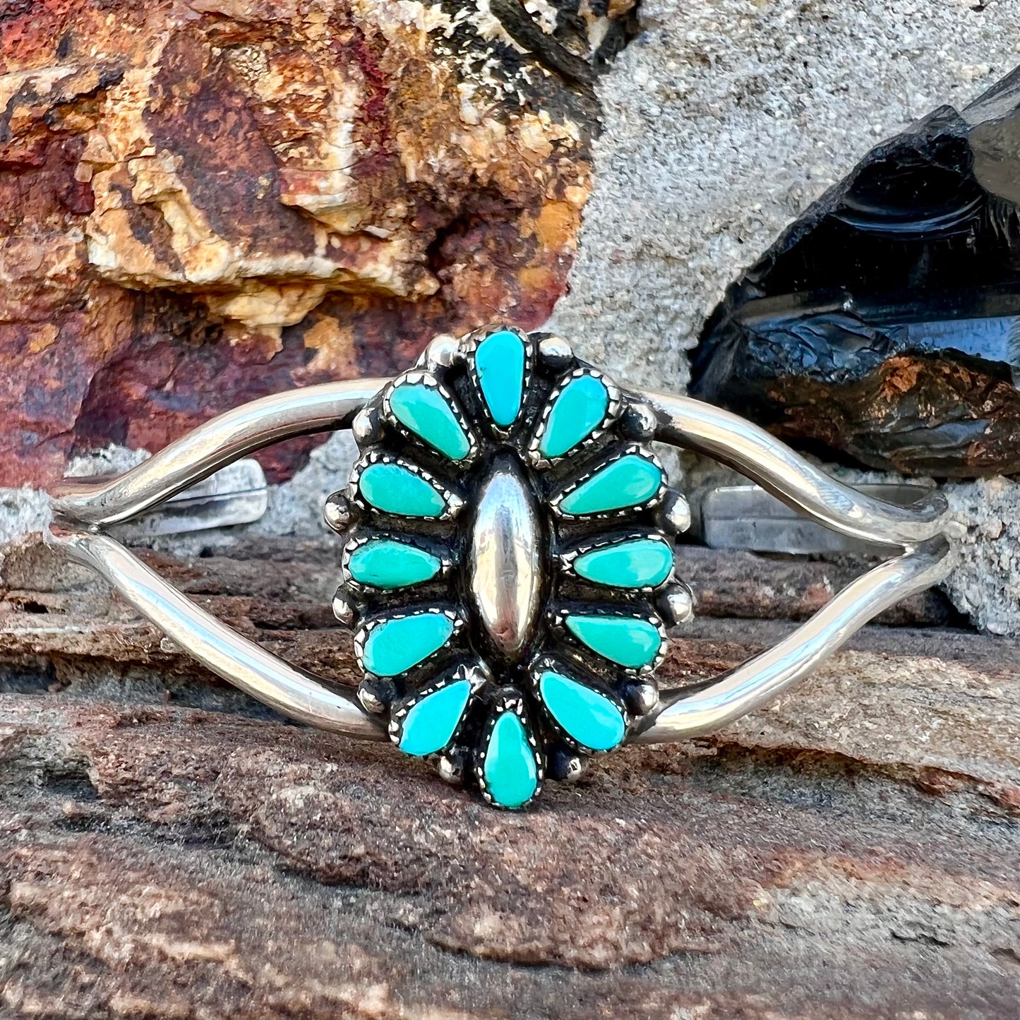 A Zuni style petit point silver turquoise cuff bracelet.  The piece was handmade and signed by Maryann and Felix Chavez.