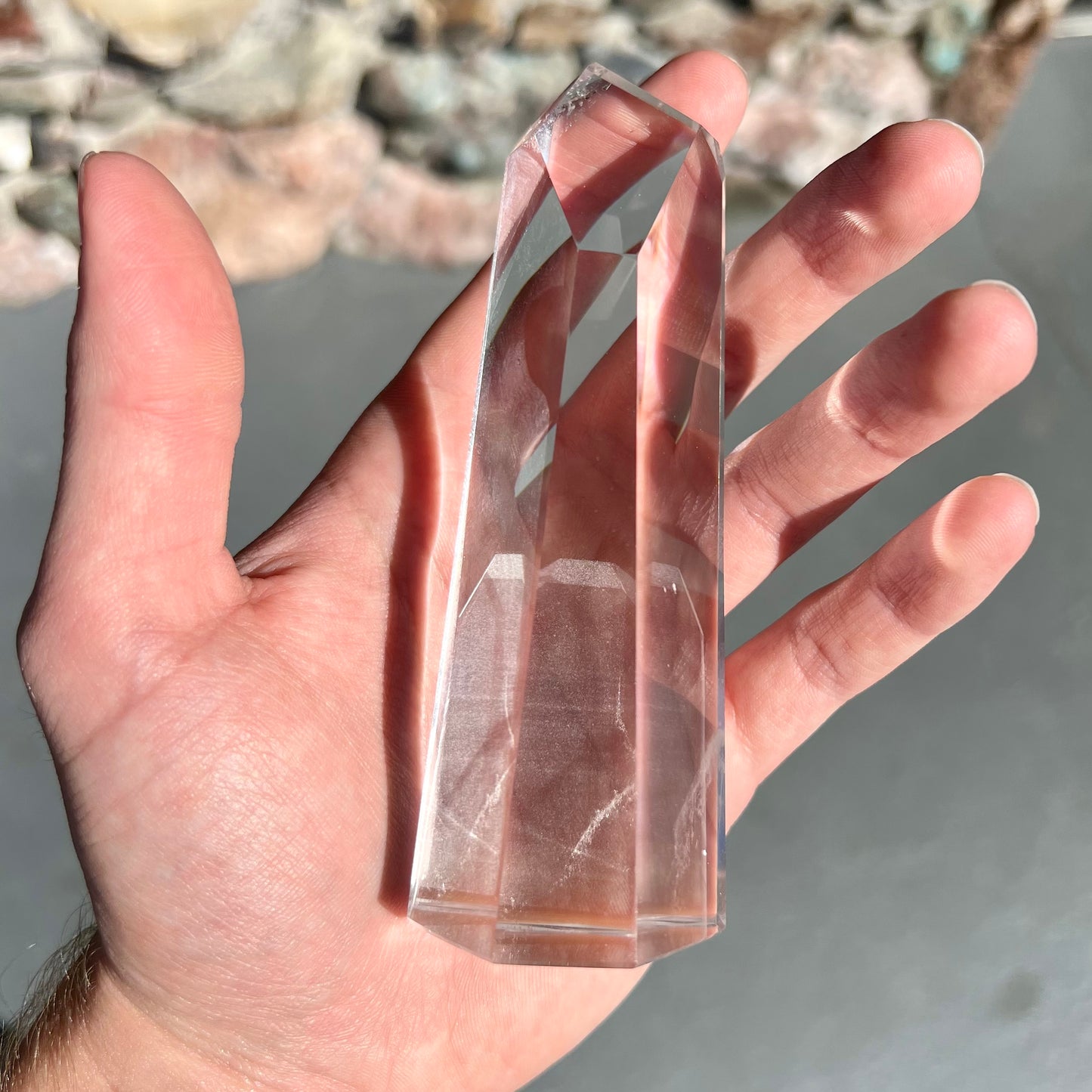 A 5.5 inch clear quartz crystal with a tabular quartz phantom inclusion.
