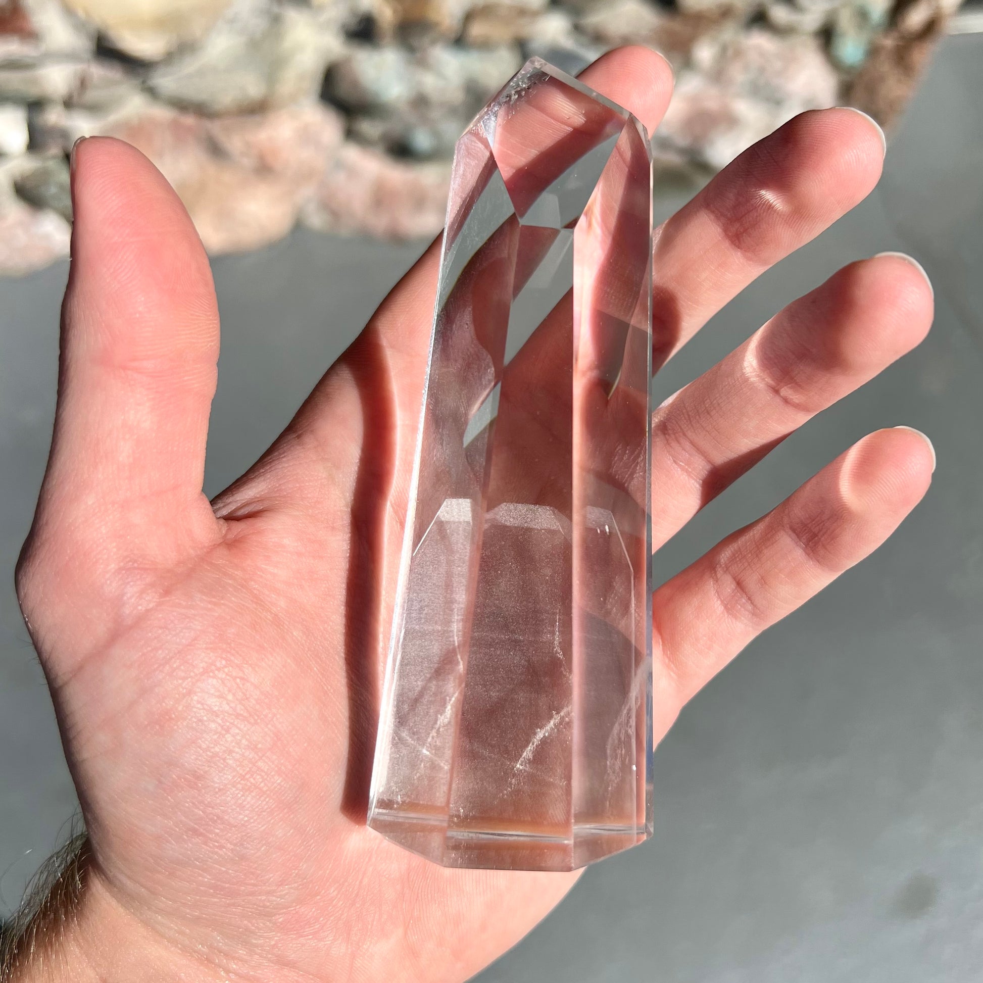 A 5.5 inch clear quartz crystal with a tabular quartz phantom inclusion.