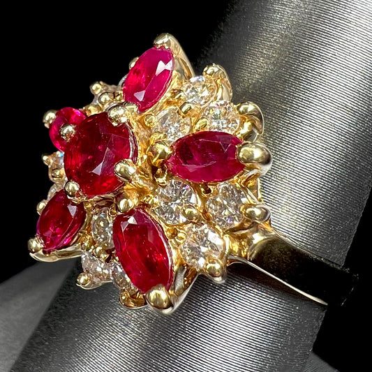 A ladies' vintage yellow gold cluster ring set with diamonds and pigeon blood red Burma rubies.