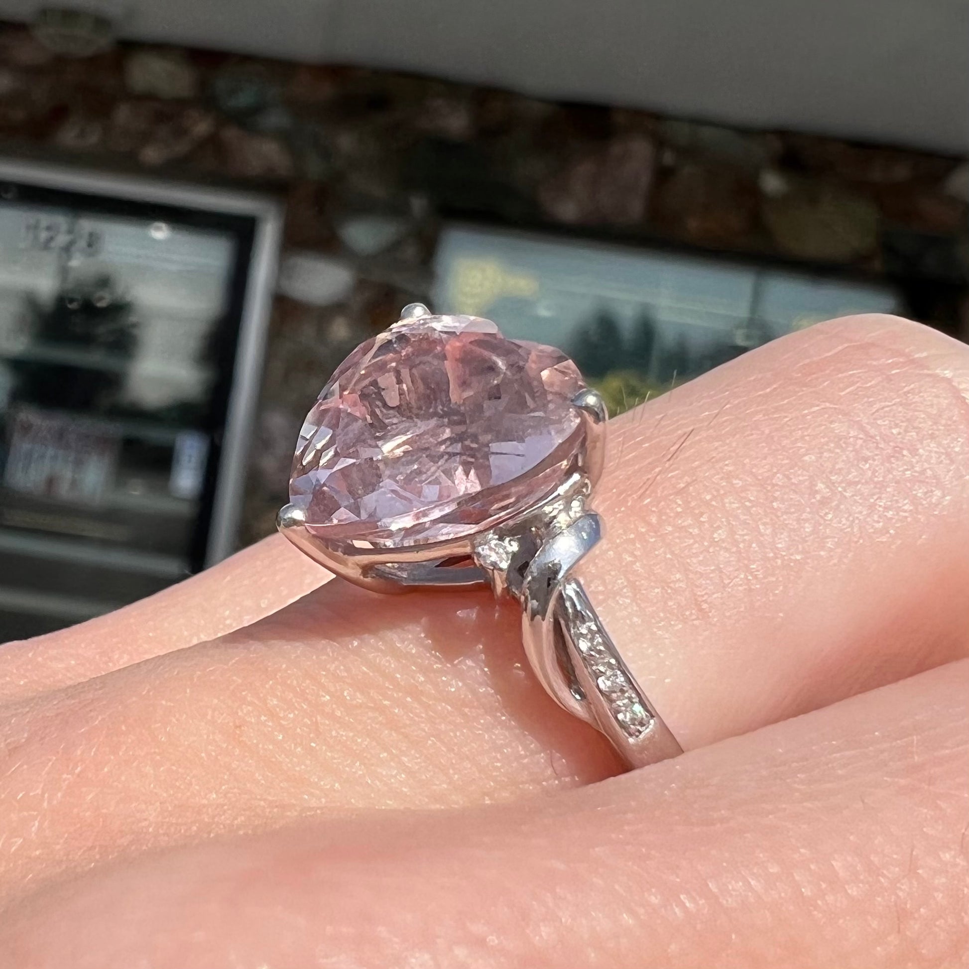 A white gold and diamond heart shaped morganite engagement ring.
