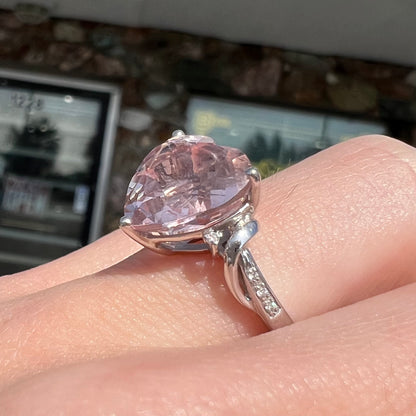 A white gold and diamond heart shaped morganite engagement ring.