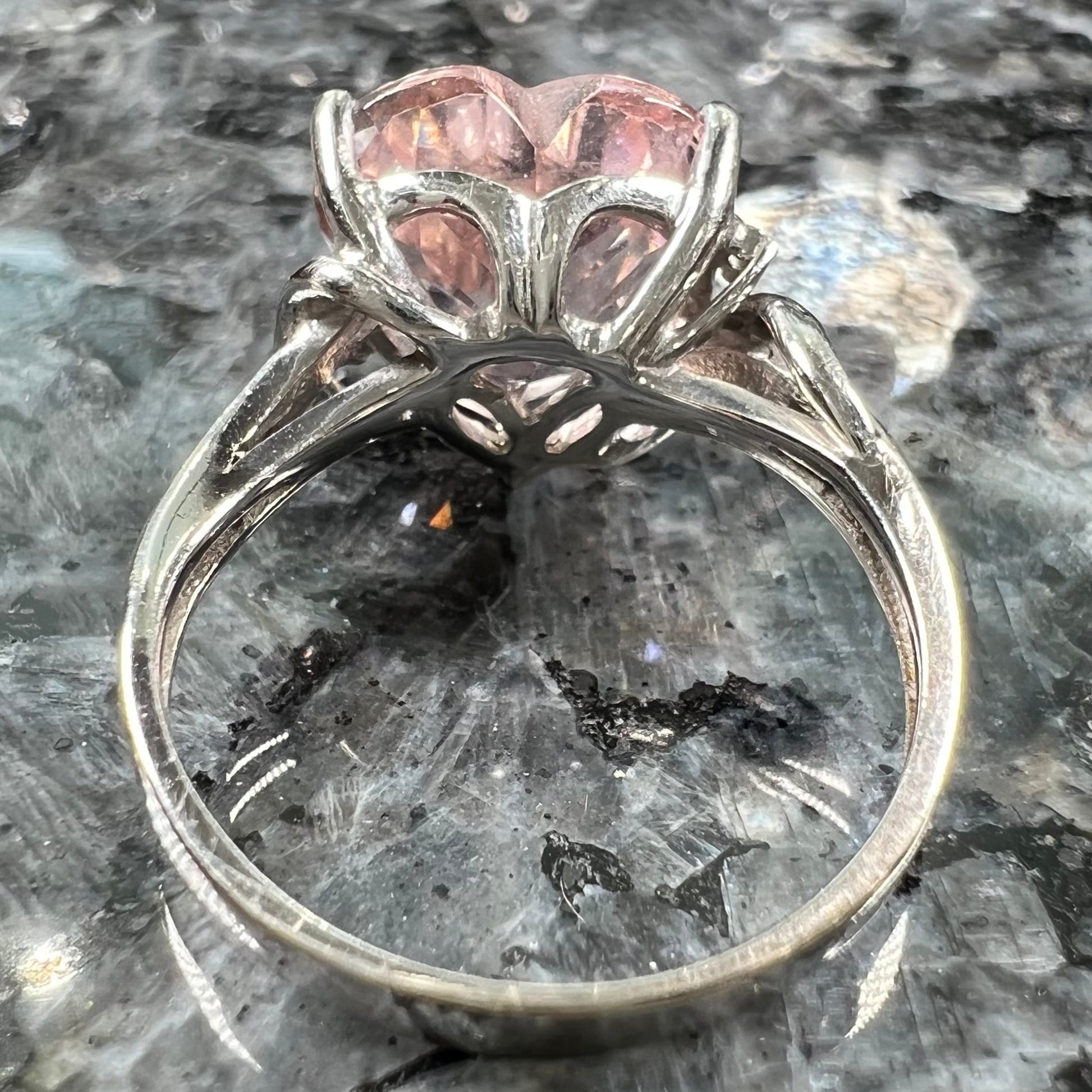A white gold and diamond heart shaped morganite engagement ring.