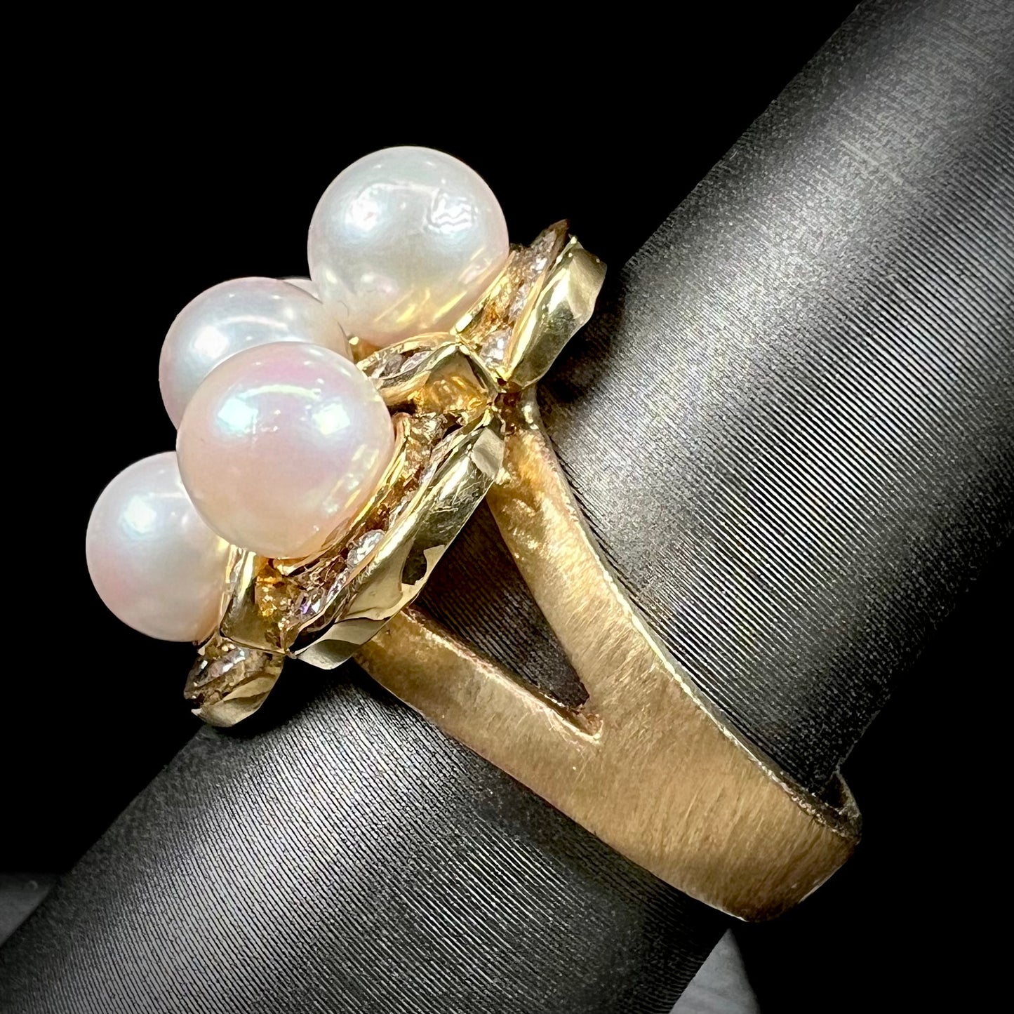 A ladies' vintage 1960's pink Akoya pearl and diamond quatrefoil ring.  The shank of the ring is textured.