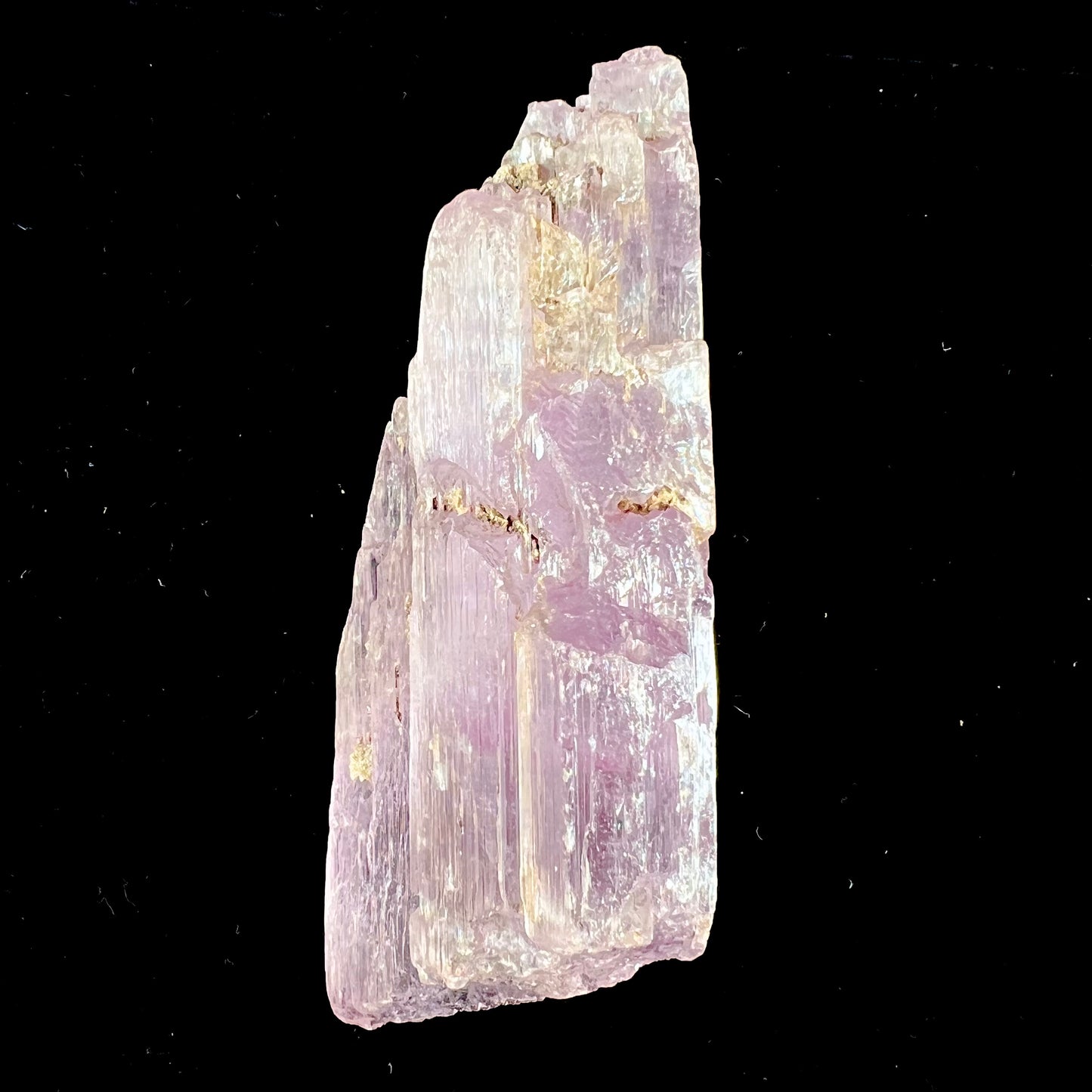 A five inch long pink kunzite crystal.  The crystal is purple when viewed down the ends.