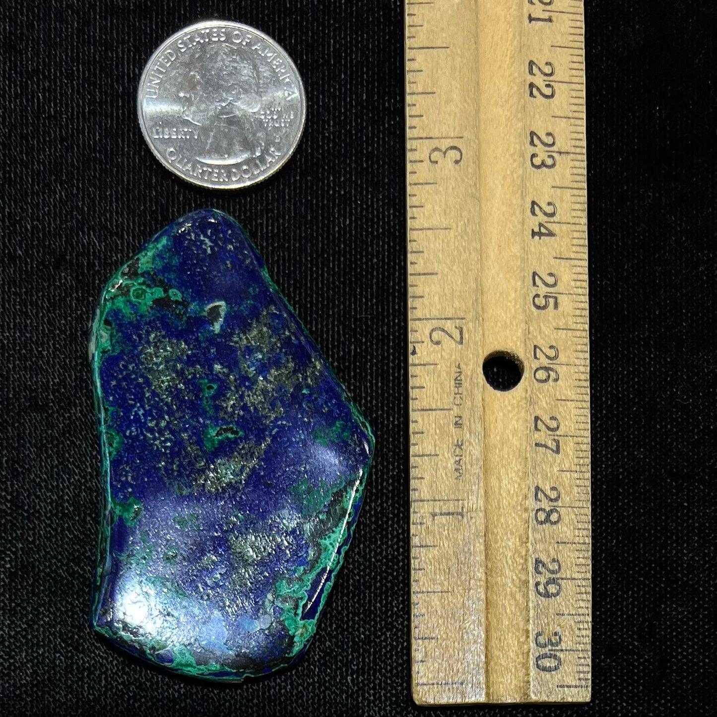 A thick polished slab of azurite with malachite inclusions.