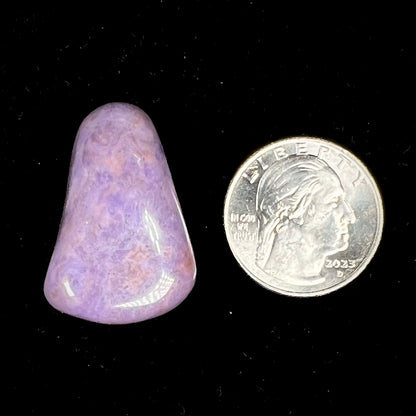 A tumbled purple turkiyenite jade stone.