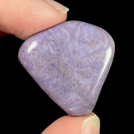 A tumble polished piece of purple turkiyenite jade stone.  Material from Bursa, Turkey.