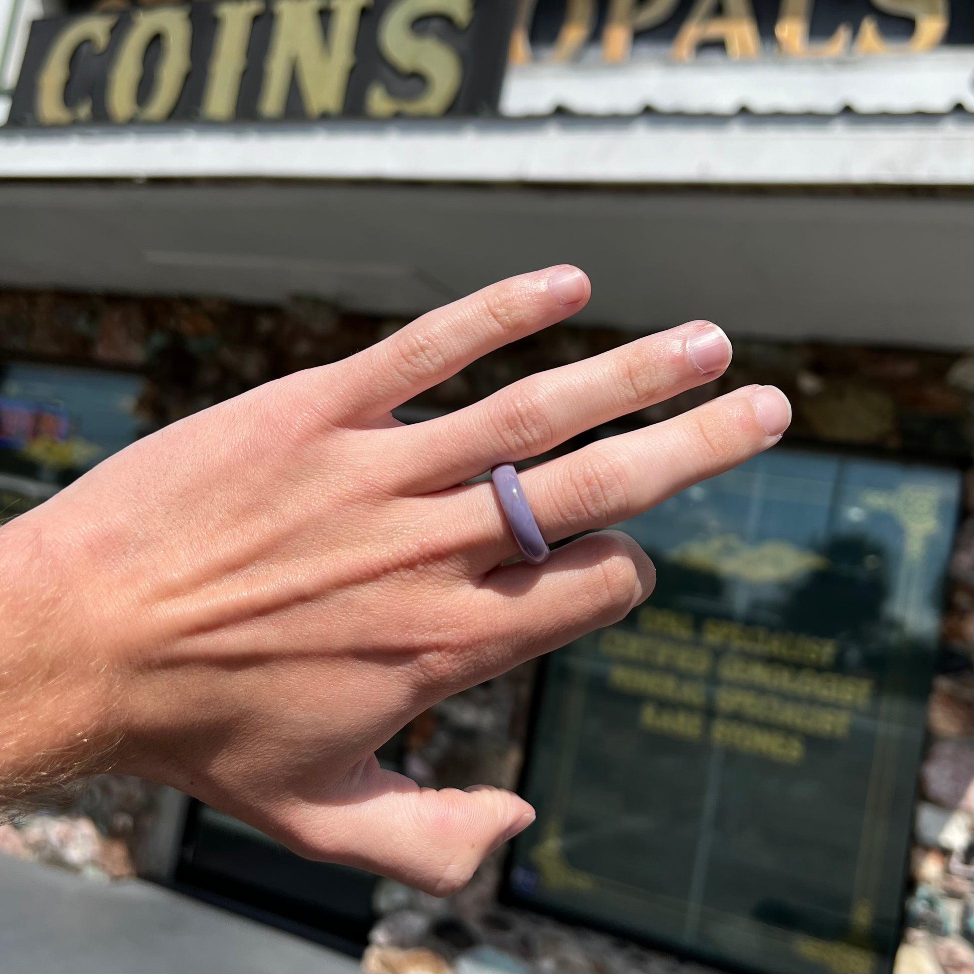 A carved lavender jade stone band.