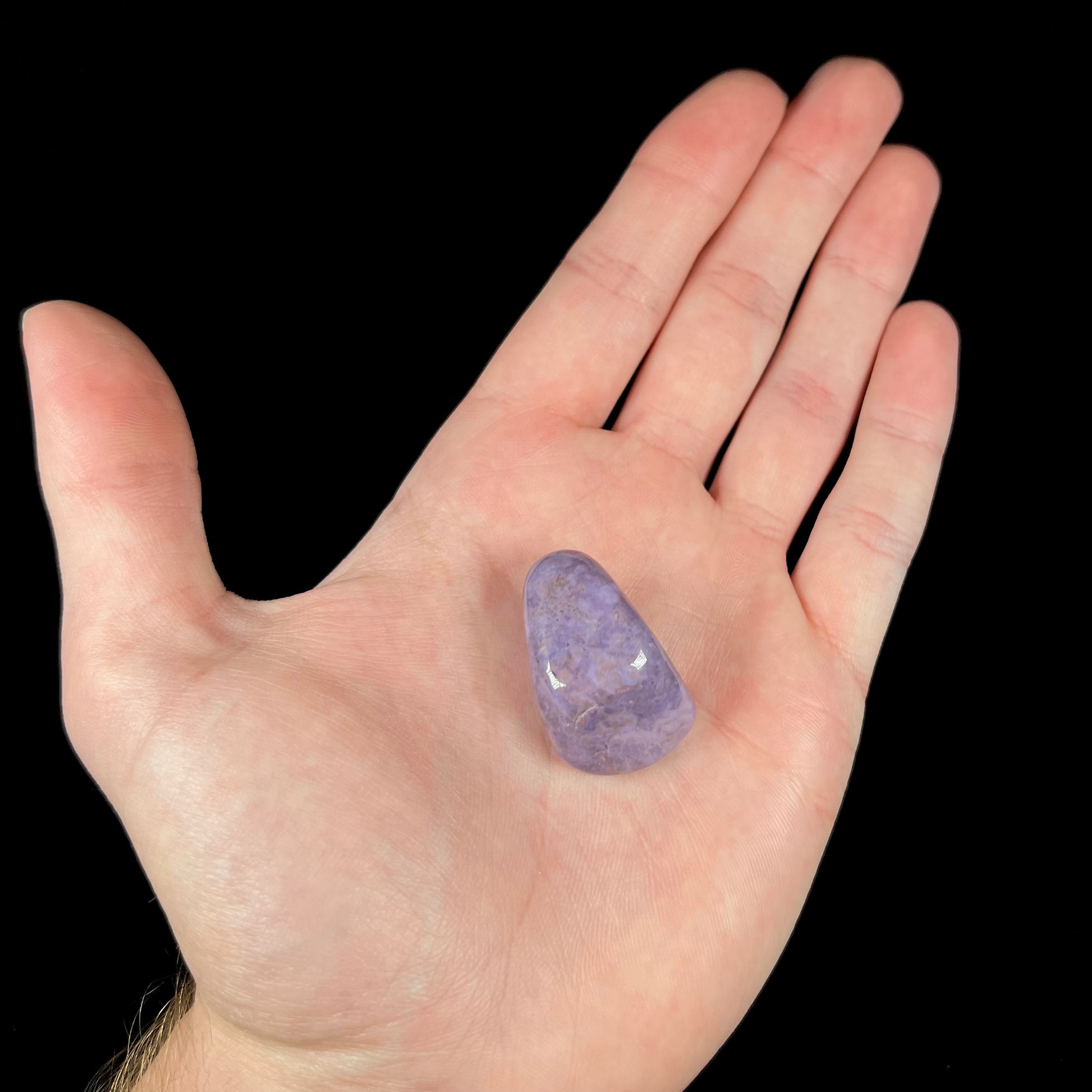 A tumbled purple turkiyenite jade stone.