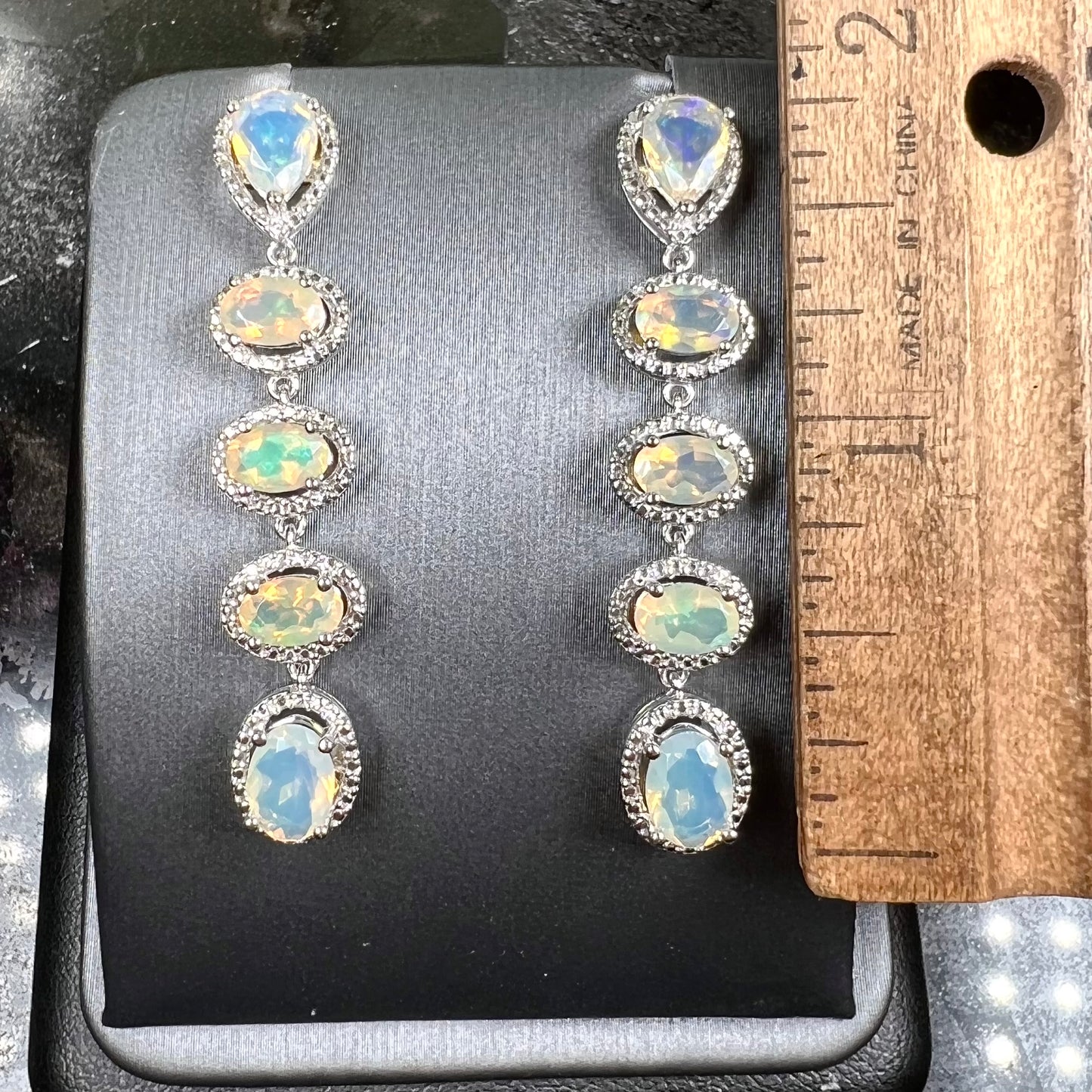 A pair of sterling silver Ethiopian opal dangle earrings.