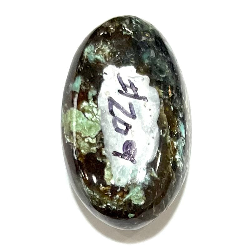 A loose, oval cabochon cut Royston turquoise stone from Nevada.