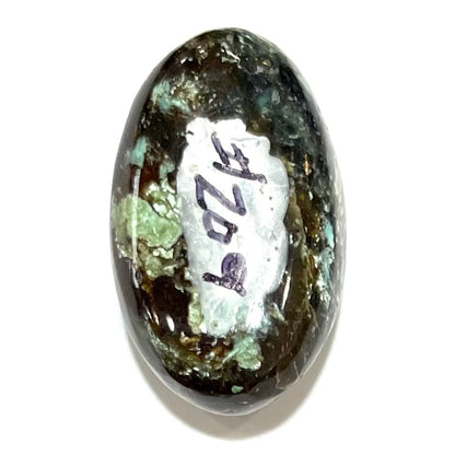 A loose, oval cabochon cut Royston turquoise stone from Nevada.