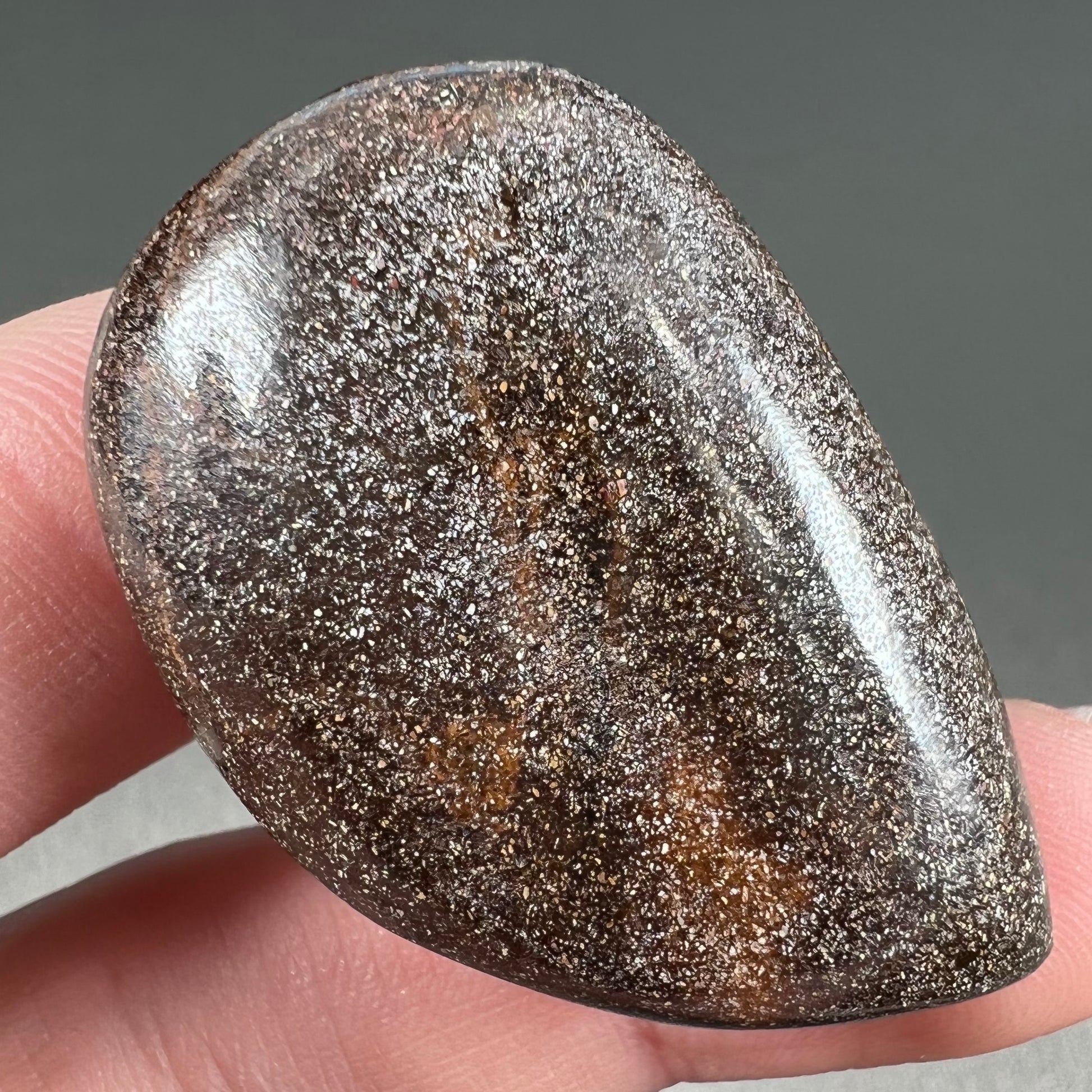 A loose, drop shaped Australian boulder opal from Quilpie Mining District.