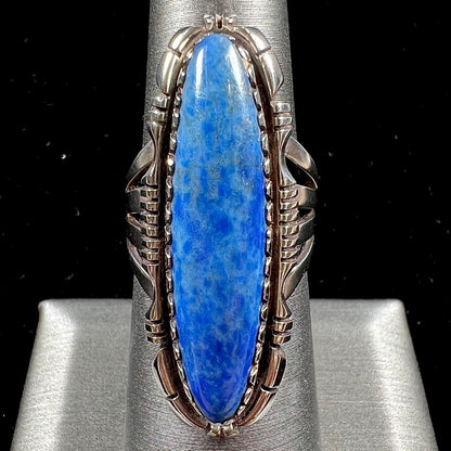 A Navajo style sterling silver lapis lazuli ring engraved with the words "R. Bennett".