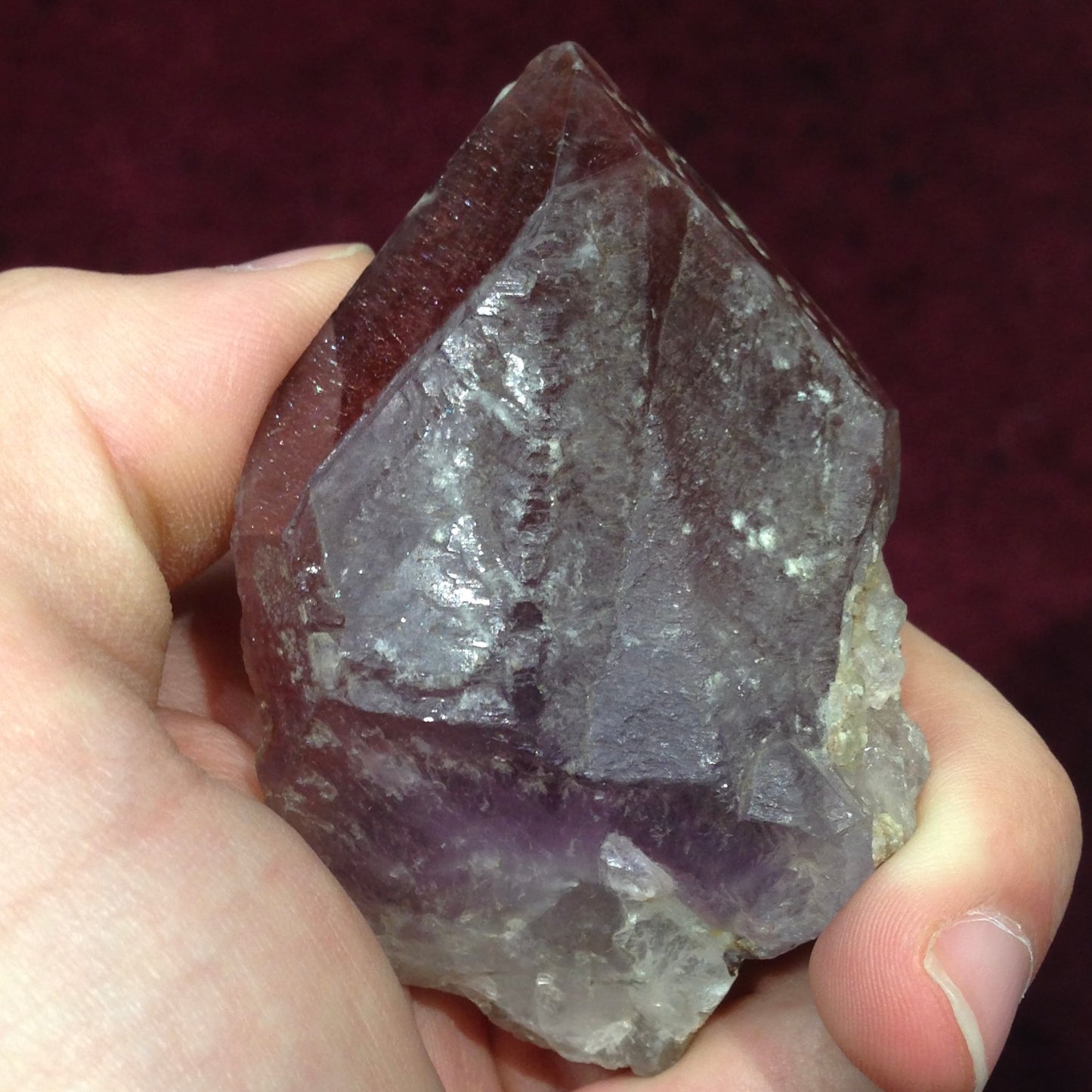 A red amethyst crystal from Mexico colored with the inclusions lepidocrocite and hematite inclusions.