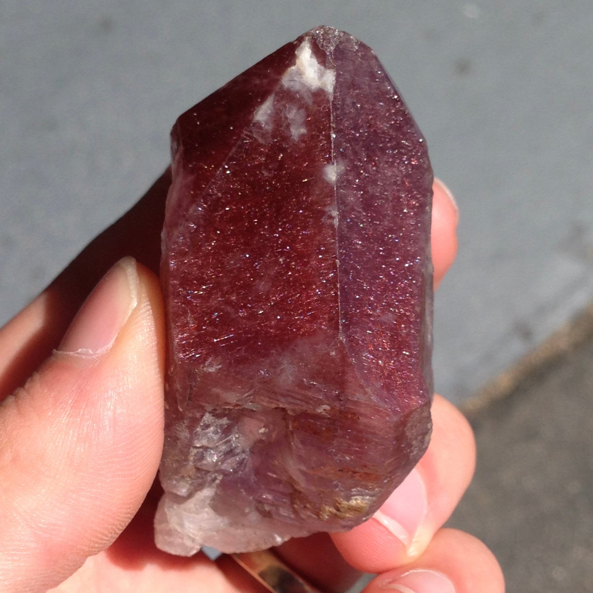 A red amethyst crystal from Mexico colored with the inclusions lepidocrocite and hematite inclusions.