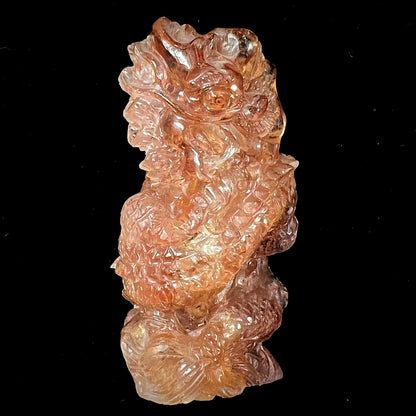 A dragon carved by Ronald Stevens from imperial topaz crystal.