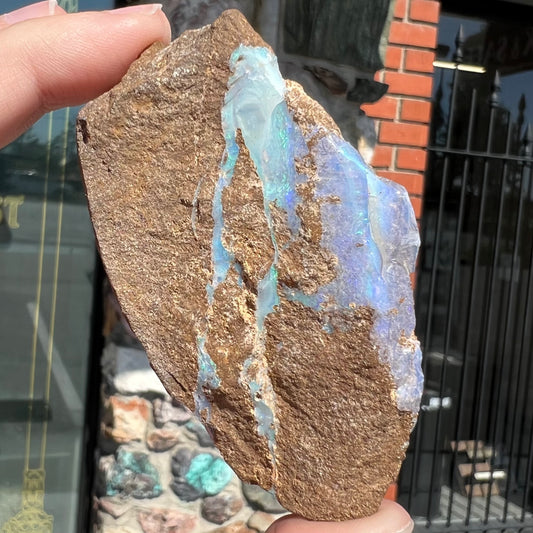 A rough boulder opal stone from Queensland, Australia.