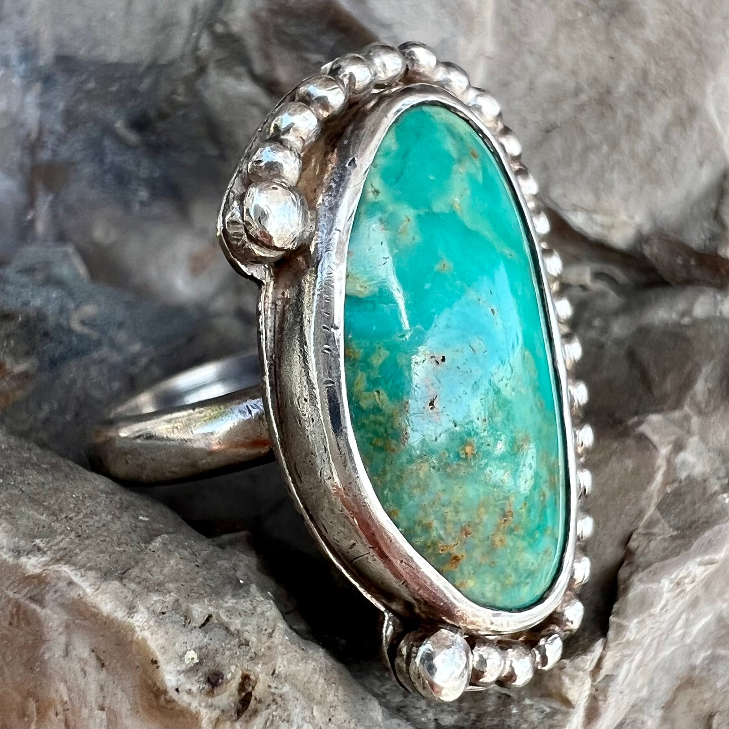 A sterling silver, Native American style green turquoise ring.  The turquoise is from the Royston Mining District.