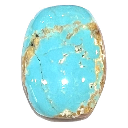 One loose polished turquoise stone cabochon from Royston Mining District.  The color is robin's egg blue with light brown matrix.