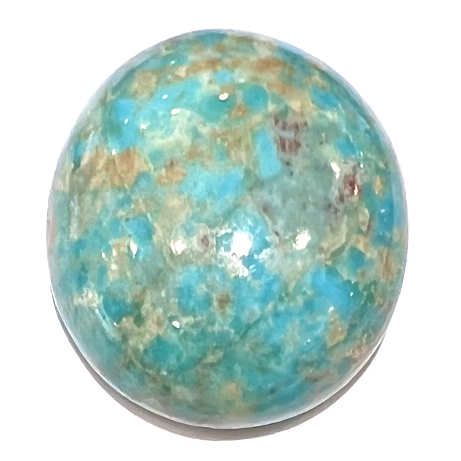 A loose, sky blue, oval cut cabochon turquoise stone from Royston District, Nevada.