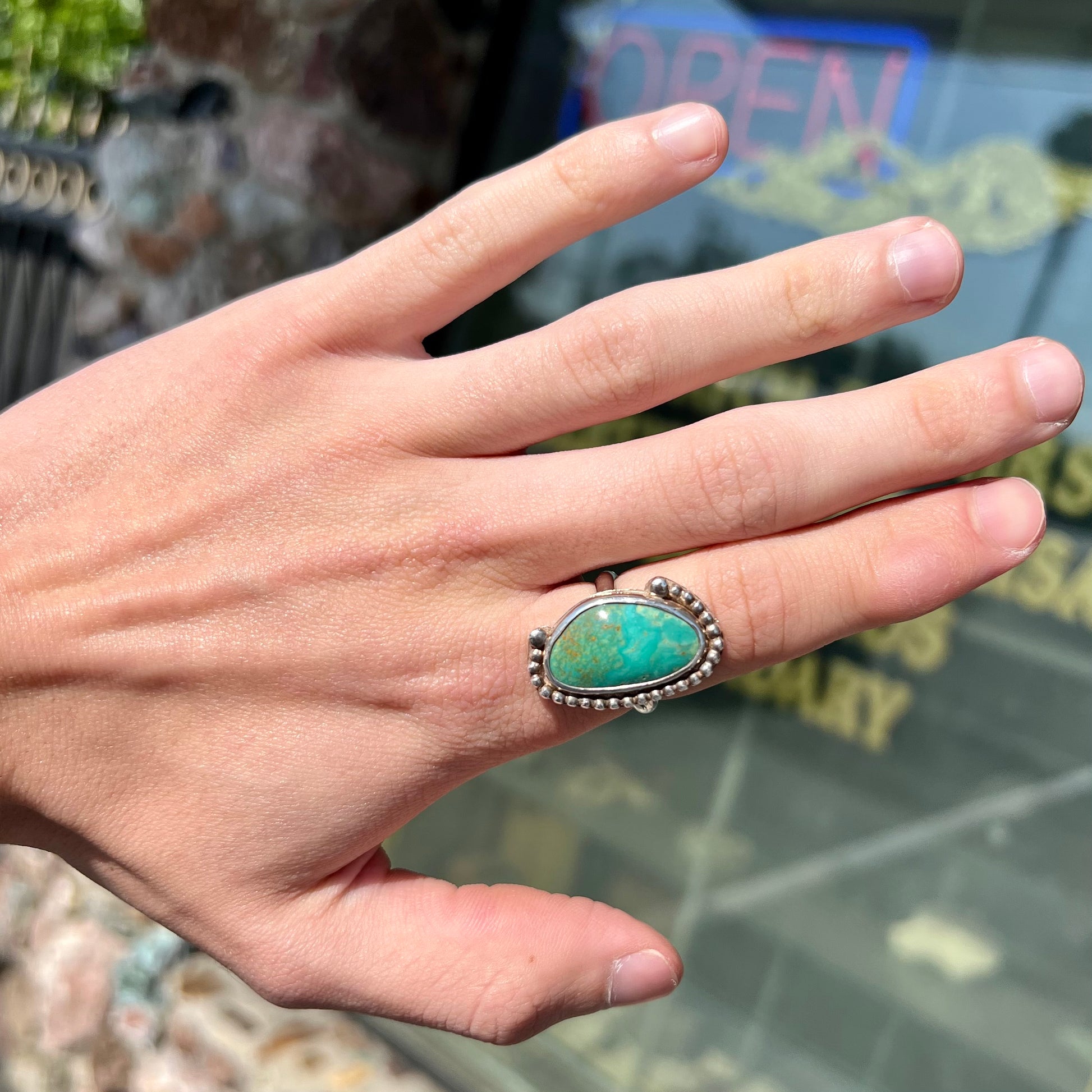 A sterling silver, Native American style green turquoise ring.  The turquoise is from the Royston Mining District.
