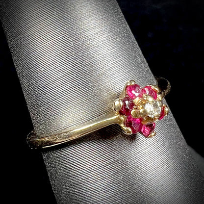 A ladies' estate yellow gold ruby and diamond cluster ring.