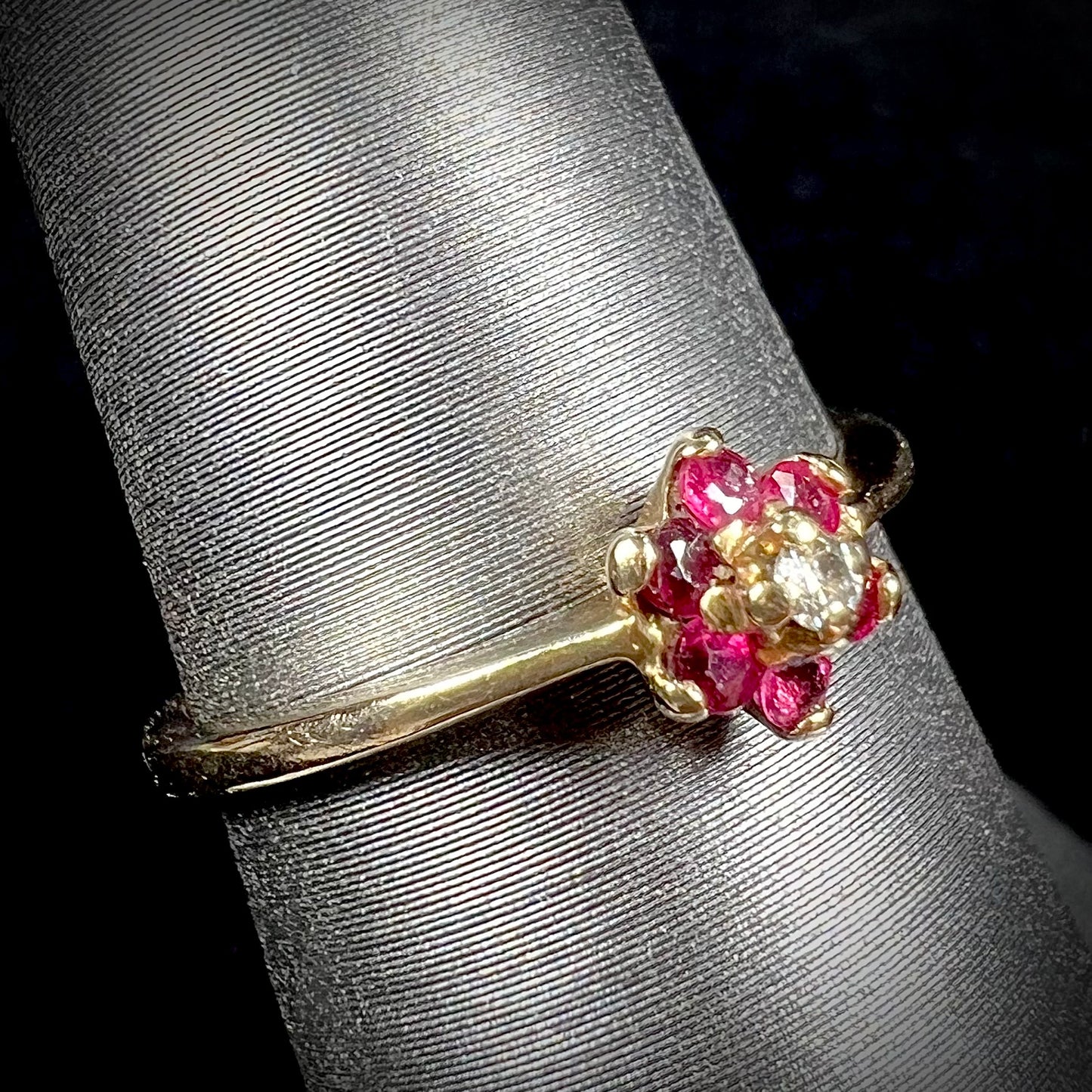 A ladies' estate yellow gold ruby and diamond cluster ring.