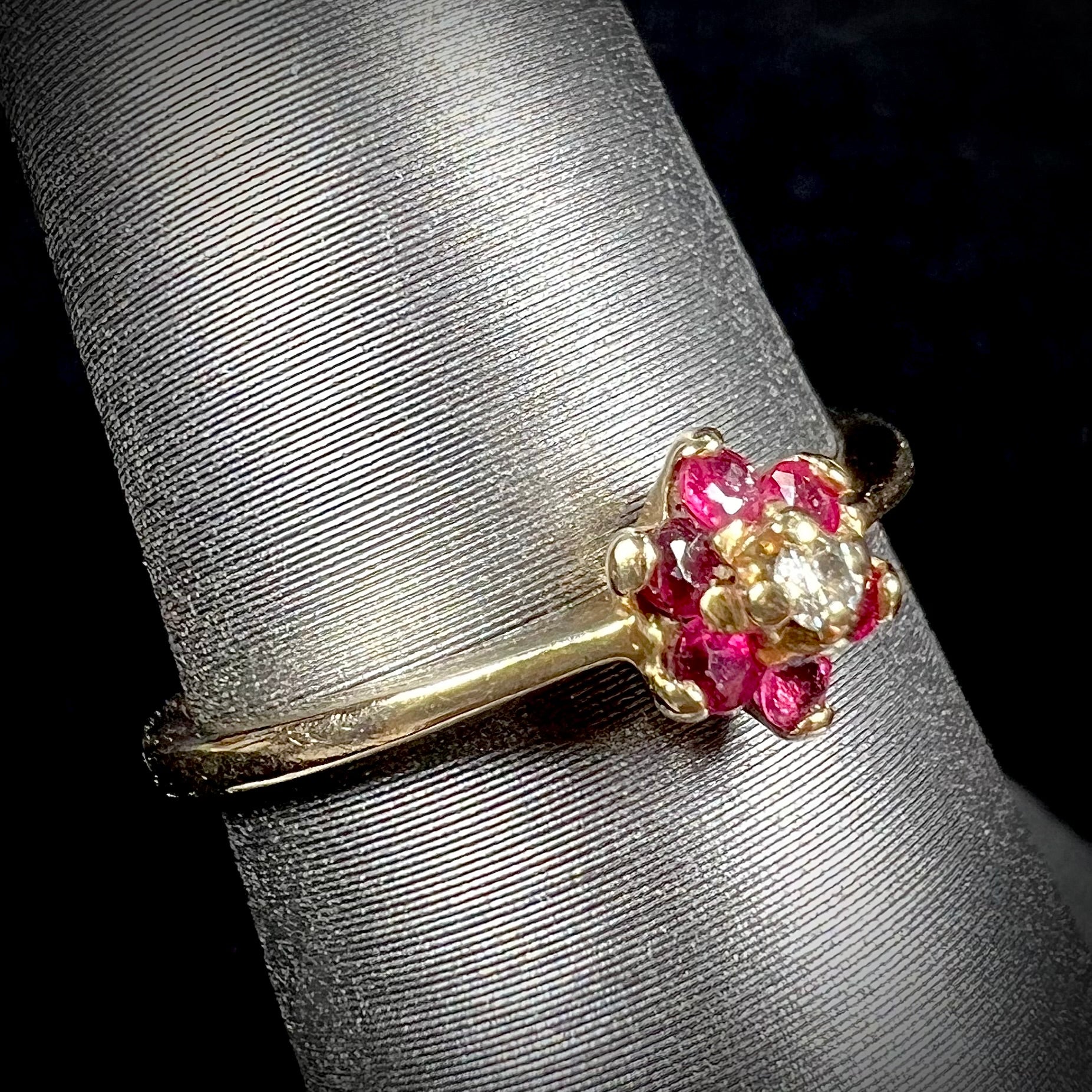 A ladies' estate yellow gold ruby and diamond cluster ring.
