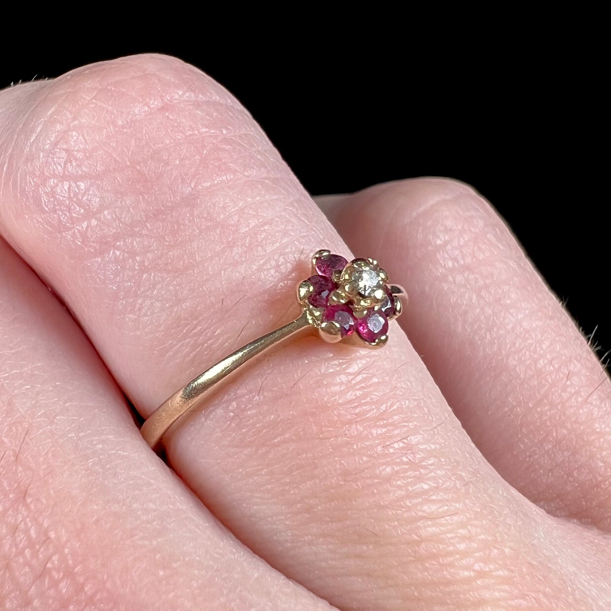 A ladies' estate yellow gold ruby and diamond cluster ring.